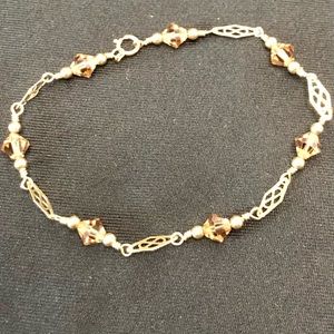 Real 12k Gold Bracelet with amber crystals.